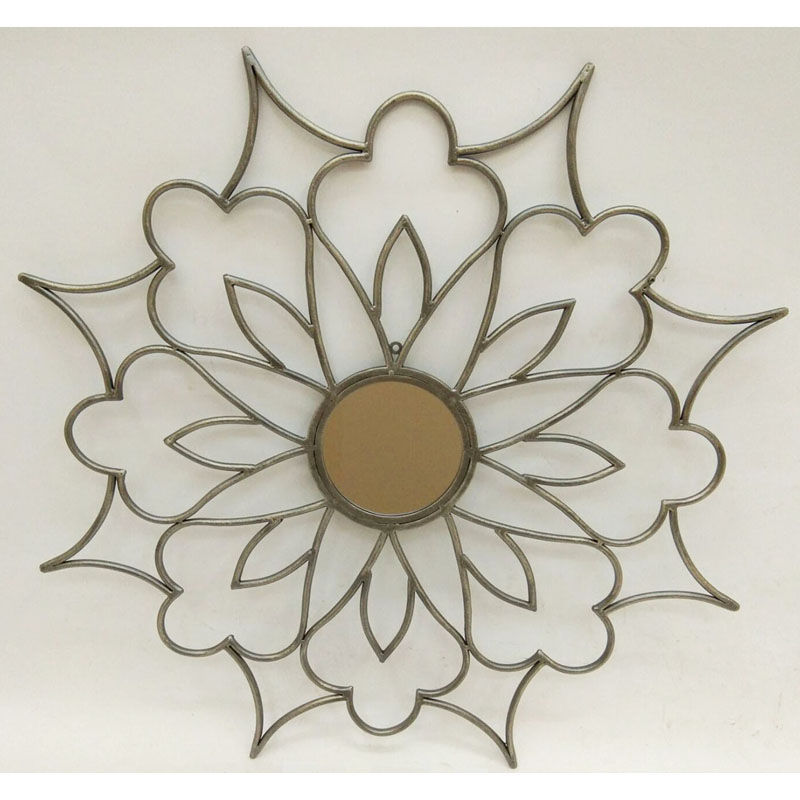 Ant. grey gold round wall decor with mirror in center and flower shape metal around the mirror